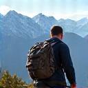 Man hiking with a scenic mountain vista